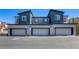 New construction townhomes feature private garages and modern, two-tone exterior paint at 12728 Feathersong St, Henderson, NV 89044