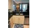 View of the bright open floor plan, including kitchen with granite countertops and stainless steel appliances at 220 Flamingo Rd # 210, Las Vegas, NV 89169