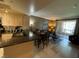 Bright open floor plan with wood floors, dining area, and balcony access provides a great living space at 220 Flamingo Rd # 210, Las Vegas, NV 89169