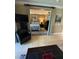 The carpeted bedroom area of living room with a view into the living space at 220 Flamingo Rd # 210, Las Vegas, NV 89169