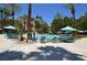 Resort-style pool offers lounge chairs, palm trees, and plenty of space for relaxation at 220 Flamingo Rd # 210, Las Vegas, NV 89169