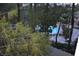 Scenic community pool area surrounded by trees and lounge chairs at 220 Flamingo Rd # 210, Las Vegas, NV 89169