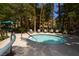 Outdoor hot tub surrounded by lush greenery and lounge chairs provides the perfect retreat at 220 Flamingo Rd # 210, Las Vegas, NV 89169