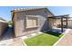 Backyard showing a patio area with a covered structure and a low-maintenance yard at 221 Mountain Cedar Ct, North Las Vegas, NV 89031