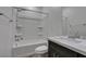 Standard bathroom with shower-tub combo, a toilet, and vanity with dark wood cabinets at 221 Mountain Cedar Ct, North Las Vegas, NV 89031