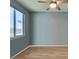 Clean bedroom with light blue walls and a large window at 221 Mountain Cedar Ct, North Las Vegas, NV 89031