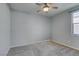 Bedroom featuring neutral paint, carpet, ceiling fan, and natural light at 221 Mountain Cedar Ct, North Las Vegas, NV 89031