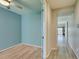 Cozy bedroom with light blue walls and wood floors at 221 Mountain Cedar Ct, North Las Vegas, NV 89031