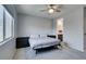 Comfortable bedroom with soft carpet, ceiling fan, natural light, and en-suite bathroom at 221 Mountain Cedar Ct, North Las Vegas, NV 89031