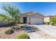 Charming single-story home with a well-manicured front yard and a two-car garage at 221 Mountain Cedar Ct, North Las Vegas, NV 89031