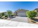 Charming single-story home with manicured landscaping, paver driveway, and a two-car garage at 221 Mountain Cedar Ct, North Las Vegas, NV 89031