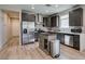Bright kitchen with stainless appliances, center island, and decorative backsplash at 221 Mountain Cedar Ct, North Las Vegas, NV 89031