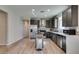 Bright kitchen with stainless appliances, center island, and decorative backsplash at 221 Mountain Cedar Ct, North Las Vegas, NV 89031