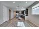 Spacious kitchen featuring stainless steel appliances, dark cabinets, and hardwood flooring at 221 Mountain Cedar Ct, North Las Vegas, NV 89031