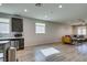 Open-concept living area features wood floors, recessed lighting, and modern kitchen at 221 Mountain Cedar Ct, North Las Vegas, NV 89031