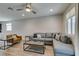 Spacious living room featuring wood floors, modern furniture, and recessed lighting at 221 Mountain Cedar Ct, North Las Vegas, NV 89031