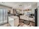 Bright kitchen with white cabinetry, stainless steel appliances, and a stylish island at 2412 El Cid Ct, Henderson, NV 89014