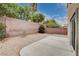 Low-maintenance backyard featuring gravel landscaping and a concrete patio, perfect for outdoor enjoyment and relaxation at 2431 Lilac Cove St, Las Vegas, NV 89135