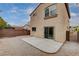 Gravel and concrete patio backyard with a sliding glass door for seamless indoor-outdoor living at 2431 Lilac Cove St, Las Vegas, NV 89135