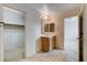 Bathroom features a vanity with a mirror and a view of a closet space at 2431 Lilac Cove St, Las Vegas, NV 89135