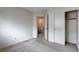 Bedroom offers neutral carpet, closet, and a doorway to other rooms in the house at 2431 Lilac Cove St, Las Vegas, NV 89135