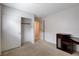 Carpeted bedroom with closet, neutral walls and workstation at 2431 Lilac Cove St, Las Vegas, NV 89135