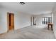 Spacious bedroom featuring neutral walls, carpeting, and access to the bathroom at 2431 Lilac Cove St, Las Vegas, NV 89135