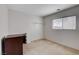Carpeted bedroom with neutral walls, window, and basic closet at 2431 Lilac Cove St, Las Vegas, NV 89135
