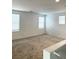 Bonus room has neutral carpet, multiple windows, and ample natural light at 2431 Lilac Cove St, Las Vegas, NV 89135