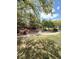 Serene community park with a charming gazebo surrounded by lush greenery and paved walking paths at 2431 Lilac Cove St, Las Vegas, NV 89135