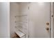 Hallway featuring wire shelving unit and a neutral wall and door to the outside at 2431 Lilac Cove St, Las Vegas, NV 89135