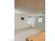 Empty loft with carpet, white walls, and two windows at 2431 Lilac Cove St, Las Vegas, NV 89135