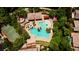 Aerial view of a community pool featuring a waterslide, splash pad, and basketball court at 2431 Lilac Cove St, Las Vegas, NV 89135