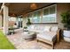 Inviting back patio with comfortable seating, a fire pit, and well-maintained landscaping at 2450 Amatrice St, Henderson, NV 89044