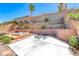 Private tiered backyard with beautiful landscaping, hot tub, and patio at 2528 Flodden St, Henderson, NV 89044