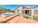 A private backyard boasts a hot tub and well established landscaping at 2528 Flodden St, Henderson, NV 89044