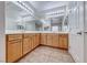 Bathroom featuring double sinks and wood cabinetry at 2528 Flodden St, Henderson, NV 89044