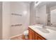 Well-lit bathroom featuring a vanity with a sleek countertop and modern fixtures at 2528 Flodden St, Henderson, NV 89044