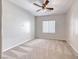 Bright bedroom with a ceiling fan, neutral color palette, and carpet at 2528 Flodden St, Henderson, NV 89044