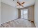 Bedroom with a ceiling fan and sliding glass doors leading to a private balcony at 2528 Flodden St, Henderson, NV 89044