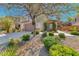 Charming home featuring low-maintenance desert landscaping and a well-kept lawn at 2528 Flodden St, Henderson, NV 89044