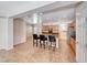 Open kitchen with stainless steel appliances, granite counters, and an island with bar seating at 2528 Flodden St, Henderson, NV 89044