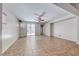 Spacious living room with tile floors and a sliding door to the backyard at 2528 Flodden St, Henderson, NV 89044