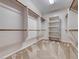 Spacious walk-in closet featuring custom shelving and ample hanging space for optimal organization at 2528 Flodden St, Henderson, NV 89044
