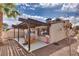 Backyard featuring a covered patio, a playhouse, and a basketball hoop for outdoor activities at 2532 Whippoorwill Ln, Las Vegas, NV 89121