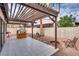 Backyard with a patio, pergola, and a charming playhouse, perfect for outdoor fun at 2532 Whippoorwill Ln, Las Vegas, NV 89121