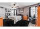 Comfortable bedroom featuring an accent wall, ceiling fan, and natural light from the window at 2532 Whippoorwill Ln, Las Vegas, NV 89121