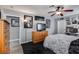 Bedroom featuring a ceiling fan, mounted TV, closet access, and neutral paint at 2532 Whippoorwill Ln, Las Vegas, NV 89121