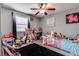 bedroom featuring decor, wood-look floors, and a ceiling fan at 2532 Whippoorwill Ln, Las Vegas, NV 89121