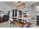 Open dining room area with a large table, a bench, and lots of natural light at 2532 Whippoorwill Ln, Las Vegas, NV 89121